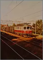 The SBB Re 4/4 I 10033 wiht a Fast Train Service from Delémont to Biel/Bienne in Lengnau. 

16.07.1984