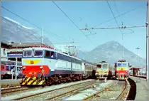 The FS E 656 274 wiht an EC to Milano in Domodossola and in the background an ohter E 656 and a D 345. 

Analog picture spring 1998