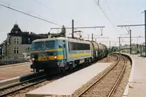 On 16 May 2002, tank train with NMBS 2149 passes slowly through the since 2013 defunct station Antwerpen-Dam.