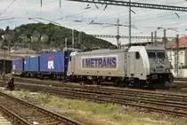 Metrans 386 002 hauls a container train through Bratislava hl.st. on 29 May 2015.
