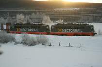 Two Hectorrail locomotives with 142 106-4  Stark  (�BB 1042 563) and 142 105-8    (�BB 1042 558) before an empty wood train on 2008/12/30 near Torpshammar.