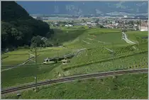 In wide curves through the Aigle vineyards, the ASD route gains the necessary height; In the picture the TPC ASD ABe 4/8 471 as R71 on the journey from Aigle to Les Diablerets. 

August 3, 2024