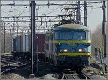 S�rie 26 double header is hauling a freight train through the station Gent Sint Pieters on February 14th, 2009. 