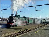 The PFT-TSP steam locomotive 64.169 (P 8) is leaving the station Gent Sint Pieters on February 14th, 2009.