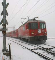 RhB Local train from Arosa to Chur is leaving in Peist. 
03.03.2009