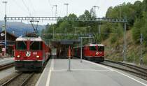 RhB Ge 4/4 II 618 in Flisur with RE to St.Moritz and Ge 4/4 II 628 with local train to Davos. 
16.09.2010