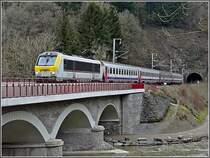 3013 with IR Liers-Luxembourg City is crossing the S�re Bridge near Michelau on January 24th, 2009.