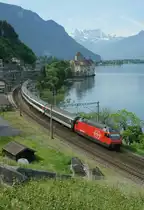 SBB Re 460 wiht an IR service to Geneva by the Castle of Chillon. 
08.06.2010