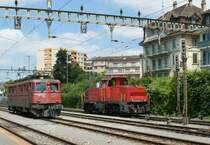 An Ae 6/6 and the Am 841 035-7 in Renens VD. 
04.16.2010.