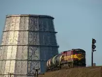 C30-7 1525 with an empty oil train leaves the port area over the big road bridge