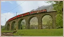 A RhB local train to St. Moritz on the famous Brusio Circle -Viaduct. 
08.05.2010