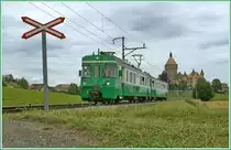 The BAM Be 4/4 N� 11 and a Bt by the Castle of Vullens. 24. 07.2009