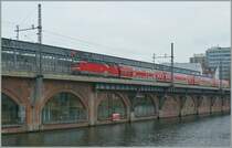 A DB E 143 with a Local train on the  Jannovitzbrcke  in Berlin.
25.11.2008