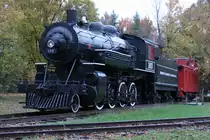 Locomotive TORONTO  HAMILTON & BUFFALO RY. (TH&B) 103 is a 2-8-0 Consolidation type steam locomotive. It was built in 1910 by the Montreal Locomotive Works. Behind the locomotive is the TH&B caboose No.58. 2.10.2010 Westfield Pioneer Village near Rockton, Ontario.