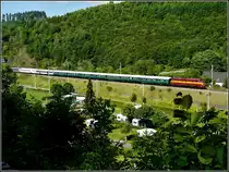 1604 is hauling heritage wagons through Clervaux on June 23rd, 2009.