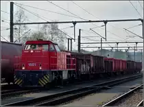 1501 is hauling a freight train through the station of P�tange on February 8th, 2011.