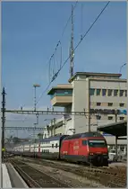 The SBB Re 460 038-3 is arriving at Lausanne with his IC from Geneva to St Gallen. 
10.03.2011