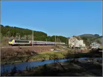 3006 is hauling the IR 117 Liers - Luxembourg City between Drauffelt and Enscherange on March 4th, 2011.