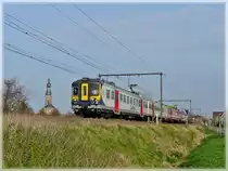 AM City Rail 995 is running through Hansbeke on April 10th, 2009. 