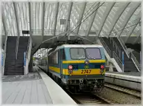 HLE 2747 is leaving the station Li�ge Guillemins with one white and two red lights on May 8th, 2010. 