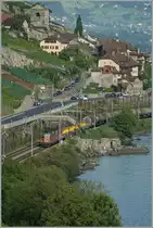The Re 4/4 II 11266 and an other one with a Cargo train by St-Saphorin. 
02.08.2011