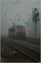 Heavy fog in Strasbourg - SNCF Sybic BB 26160 is coming with the overnight train from the south of French. 
29.10.2011