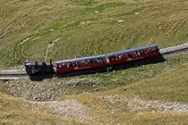 The heating oil-fired locomotive travels BRB 15 on 01.10.2011 up to the Brienzer Rothorn, here just before the Sch�negg gallery.