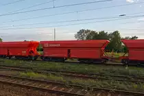 Open hopper car (ore cars) with sudden gravity discharge, hydraulic valve closure system and 6 sets of wheels (Falrrs 152), on 21.08.2011 in Toisdorf taken from a train. The Falrrs 152 is a two car unit connected with a coupling rod wagon type Faal 151, at the ends with Automatic UIC coupling (AK), no page buffer.
