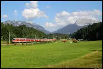 111 032-9 with a regional train to Munich near Klais. (2011-08-20)