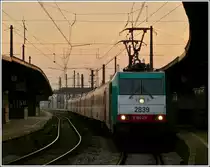 . The TRAXX HlE 2839 is heading the IC Bruxelles - Amsterdam in Bruxelles Midi in the evening of November 12th, 2011.