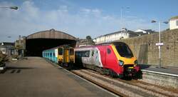 Penzance: The 150213 is the local service to St Ives and the Virgin Trains destination is Edinburgh.